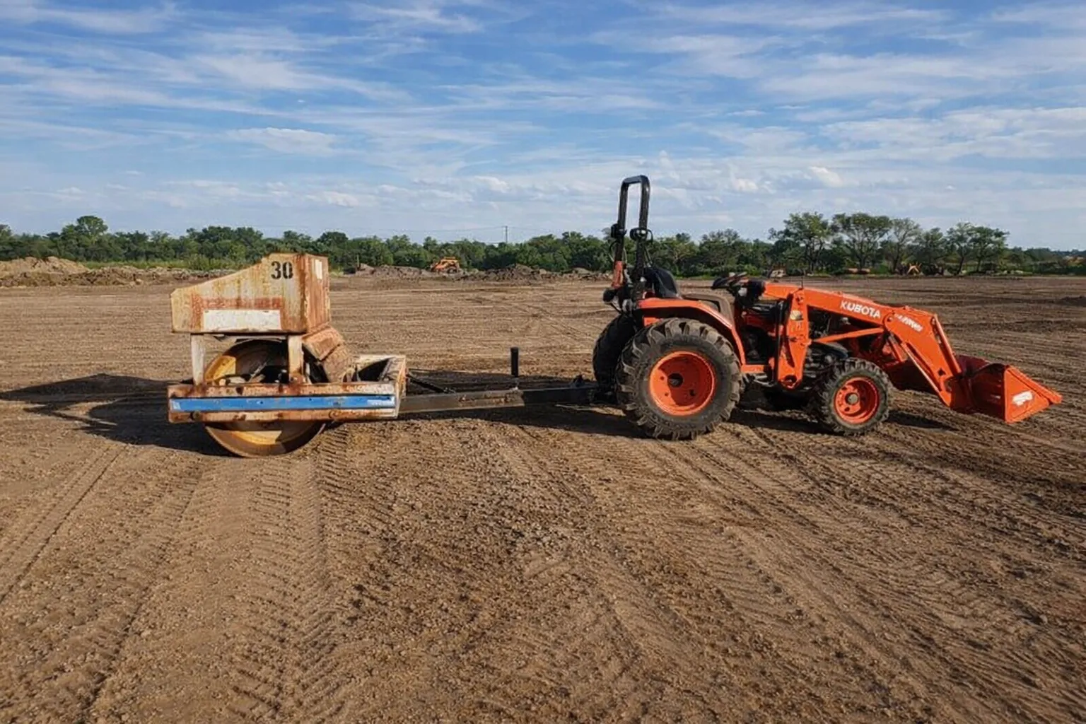  Tractor with drum roller compactor