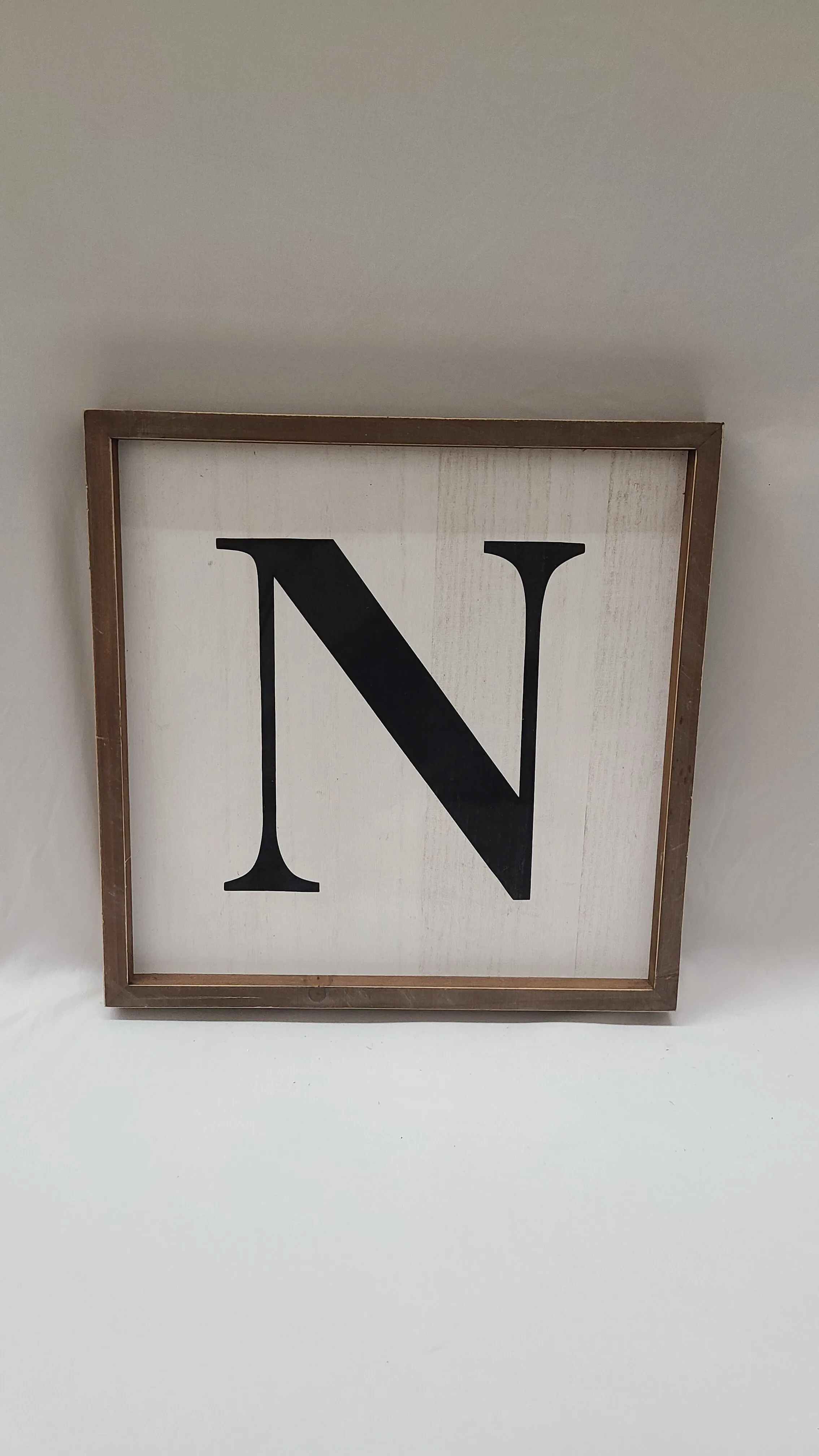 White Framed N Sign
