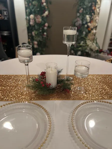 Pine Wreath with Candle and Pedestal Vases