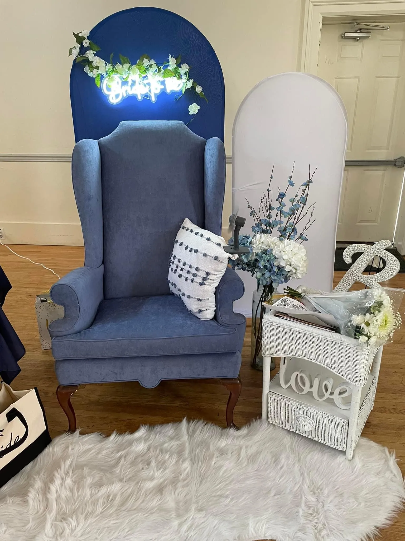 Oversized blue wingback chair