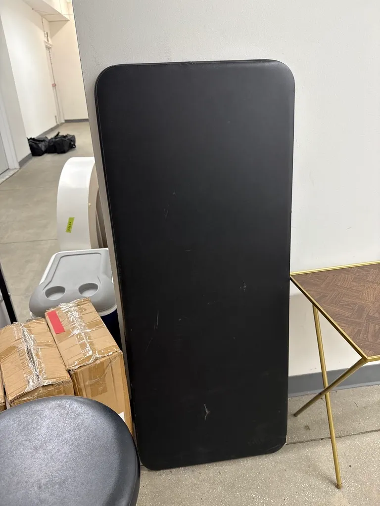 Black folding table (47¾" x 20")