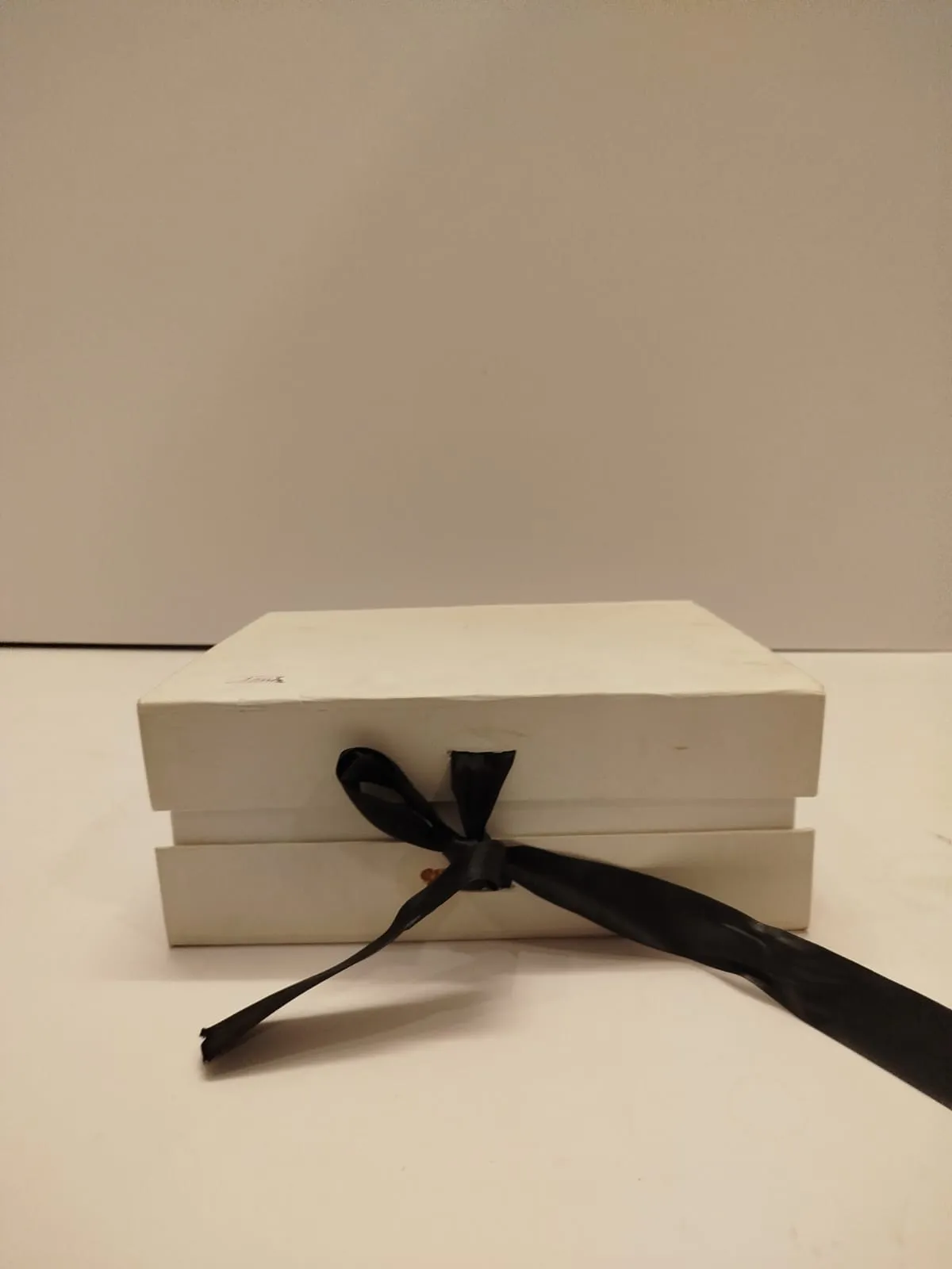 White cardboard box Size 9.5x8 inches Height 4