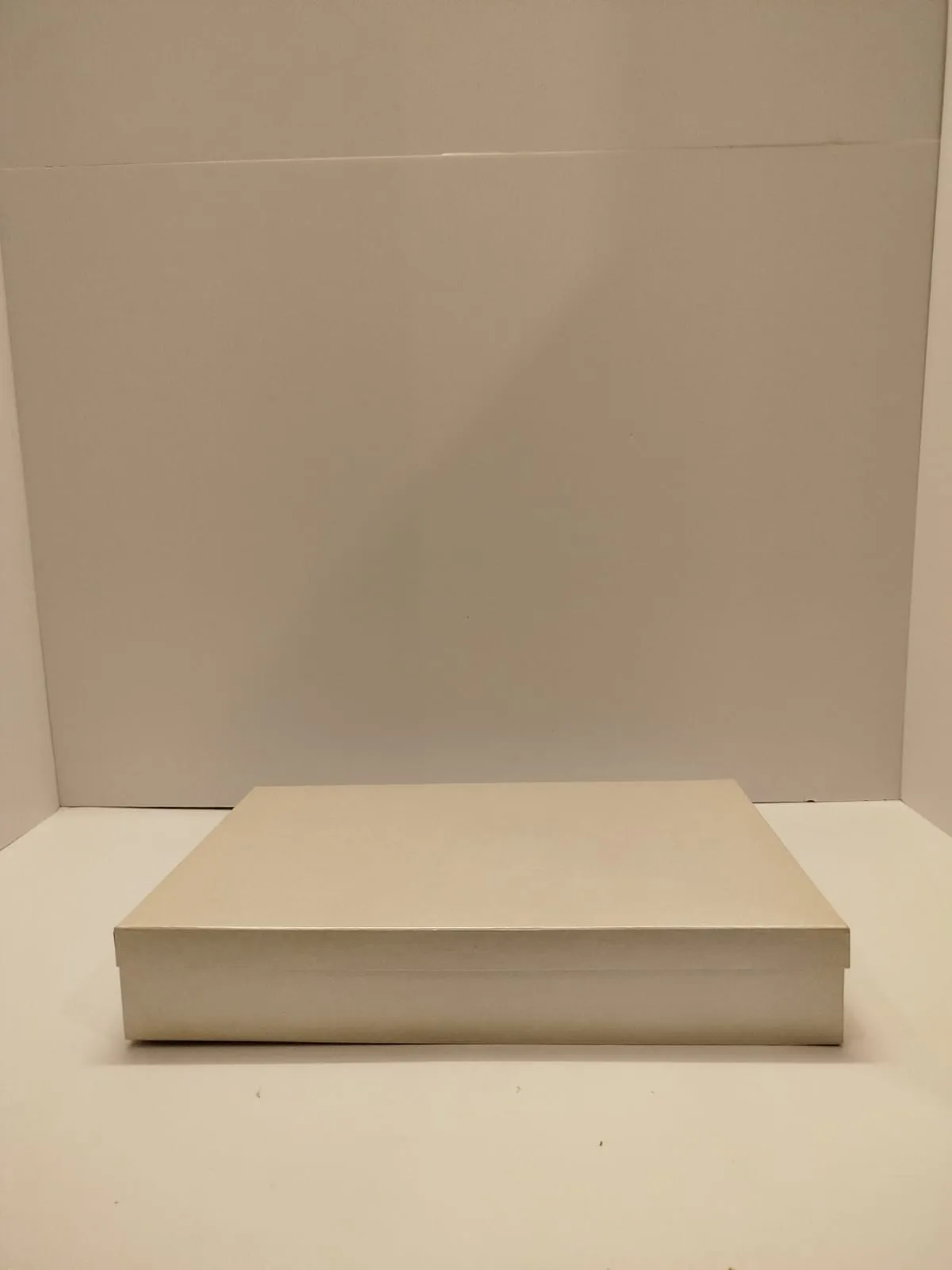 Off white cardboard box Size 12x18 inches Height 3 inches