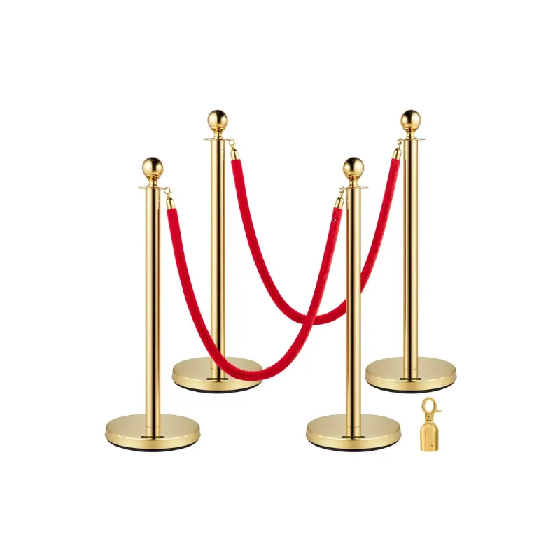 Goldene Pfosten mit rotem Samt-Seilen