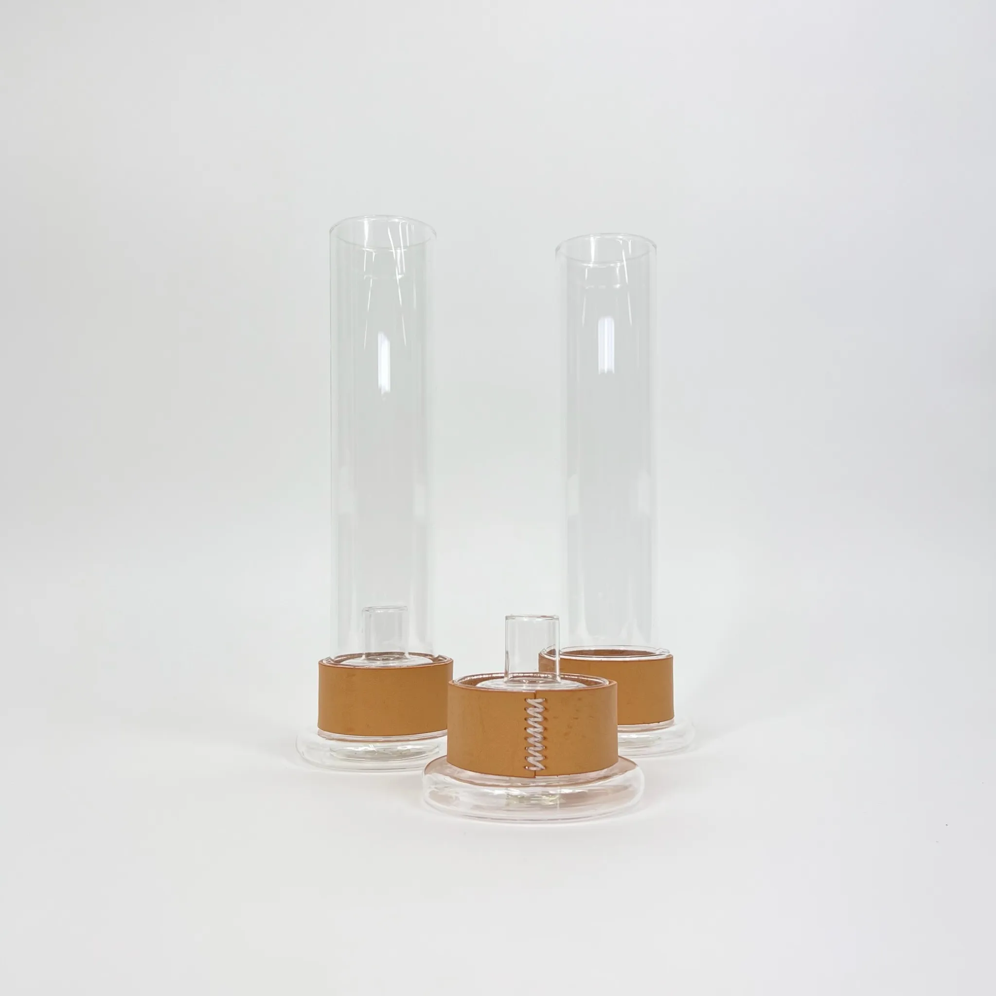 LEATHER AND GLASS CANDLESTICKS