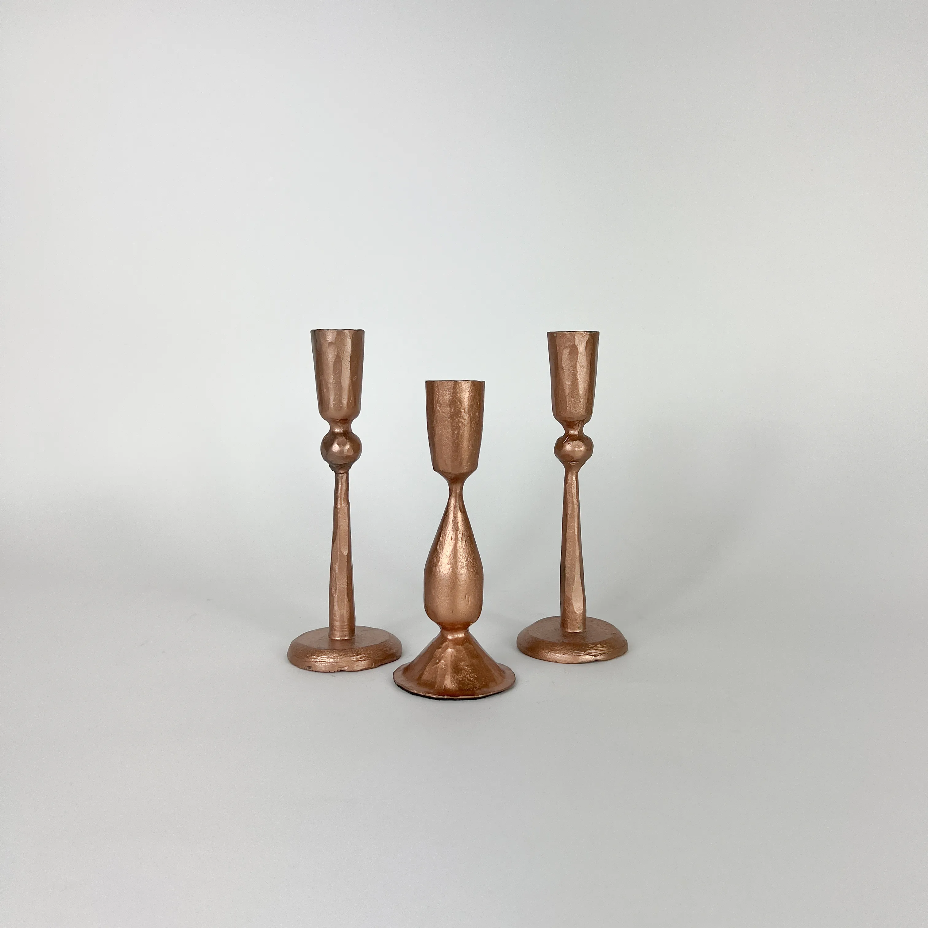 COPPER SCULPTED CANDLESTICKS