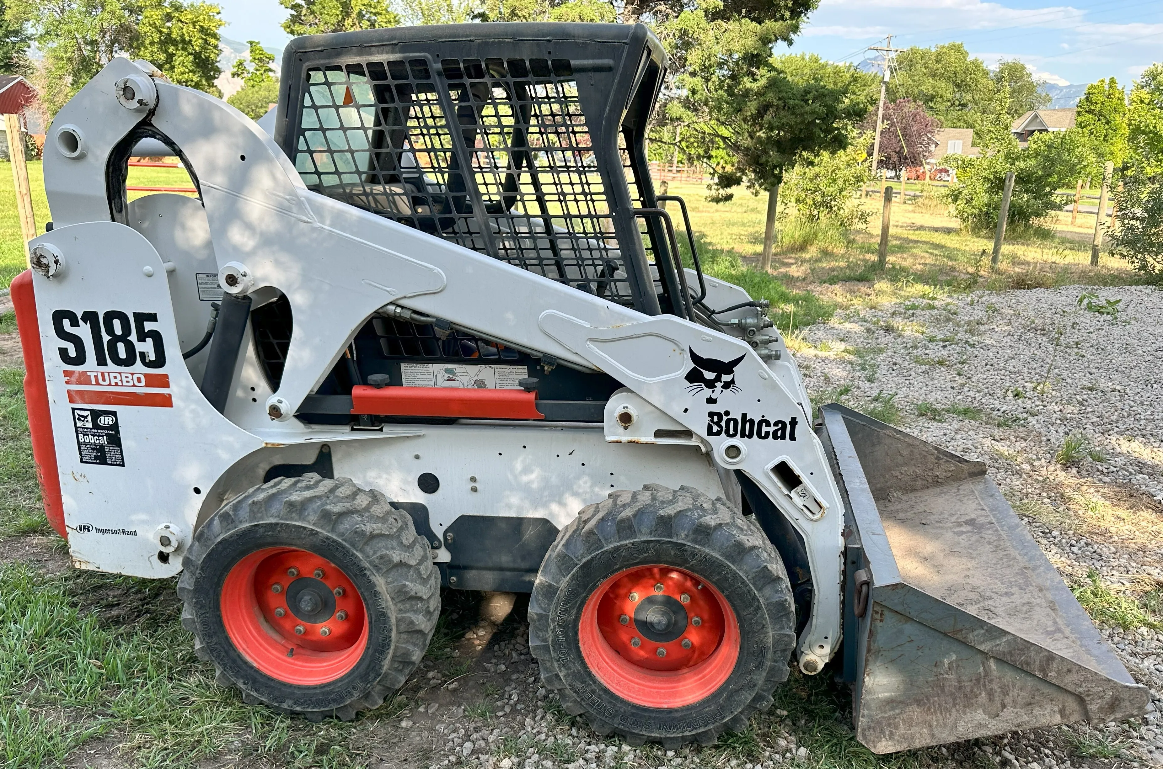 Skid steer with flatbed trailer