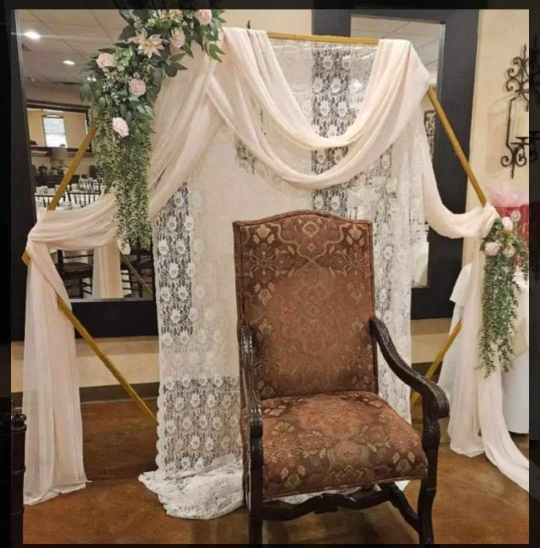 pink flowers and greenery arch flowers