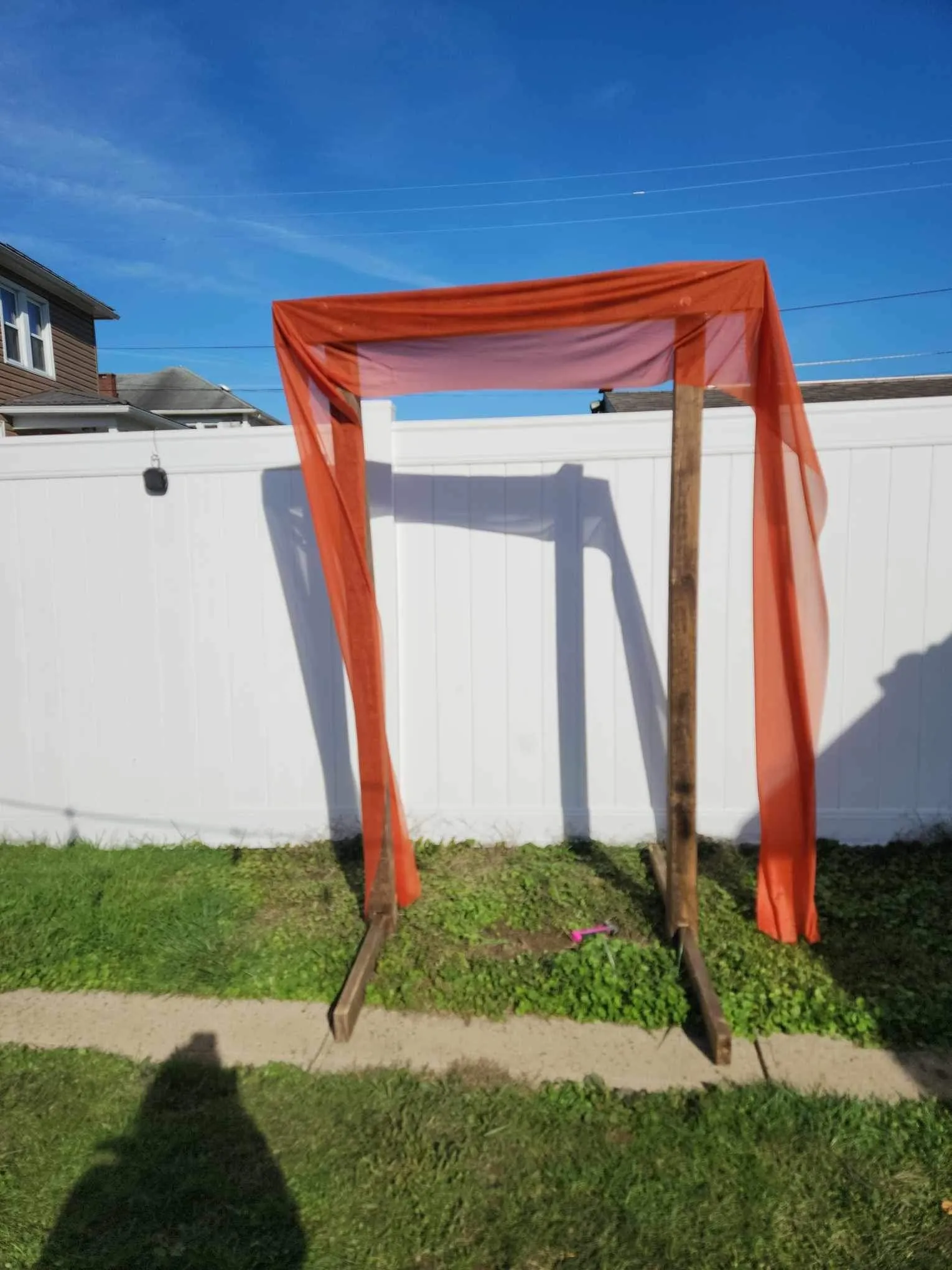 Arch- brown wood (drapes and colored flowers available for an additional charge)