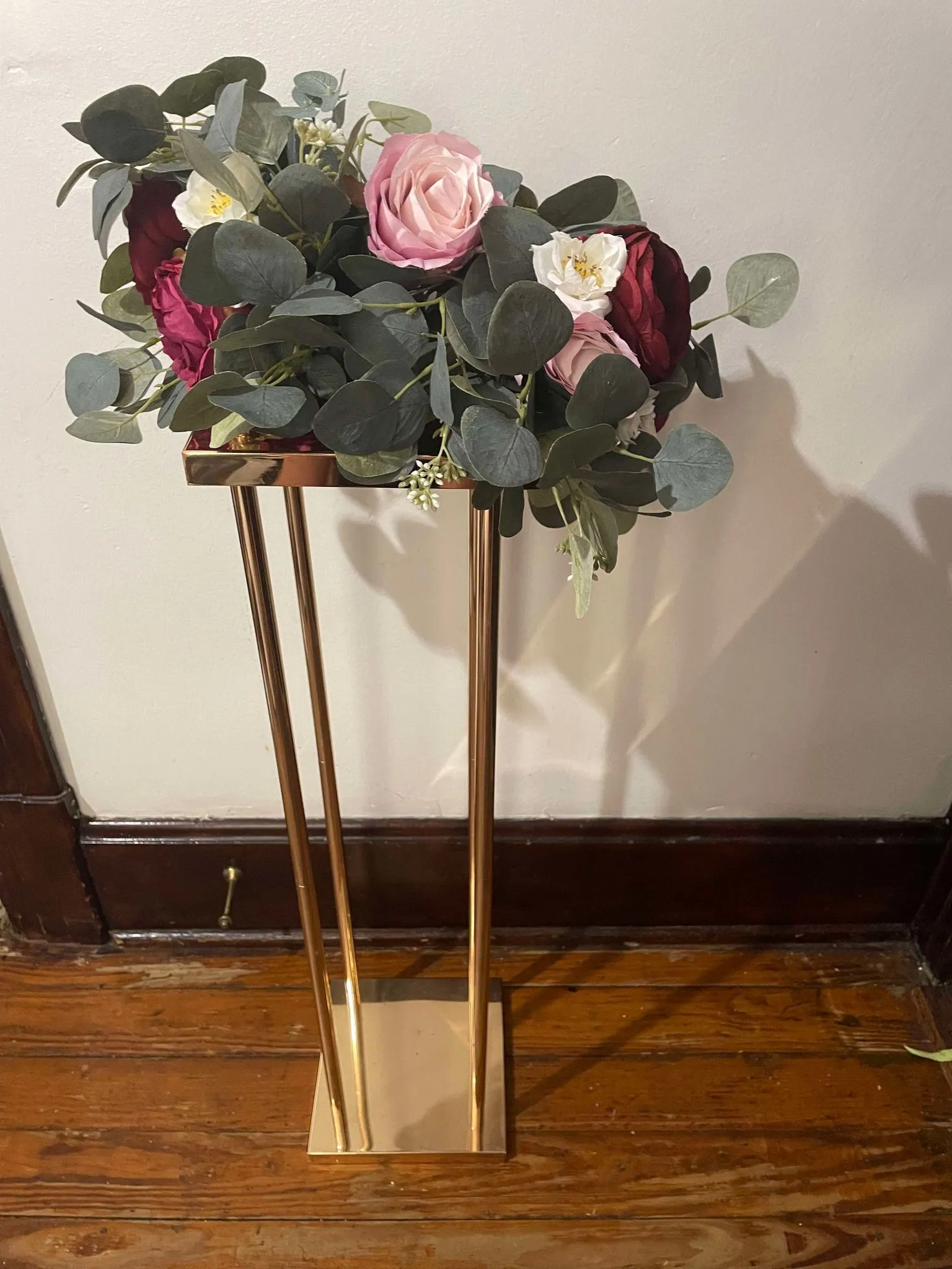 Pink flowers and flower stand