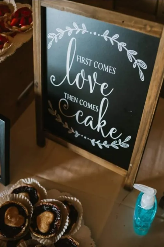 SIGN: chalkboard "first comes love then comes cake"