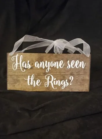 RING BEARER: sign "has anyone seen the ring?'