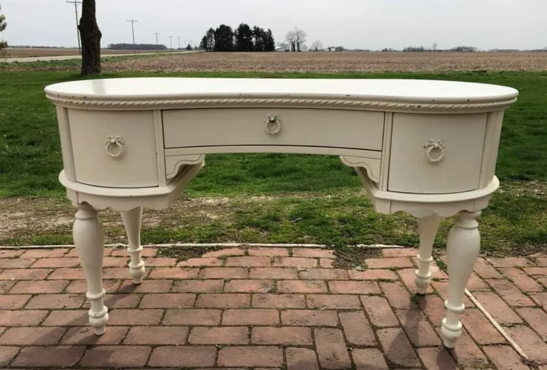 SIDE TABLE: cream antique bean shape table