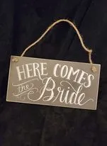 FLOWER GIRL: sign "here comes the bride"
