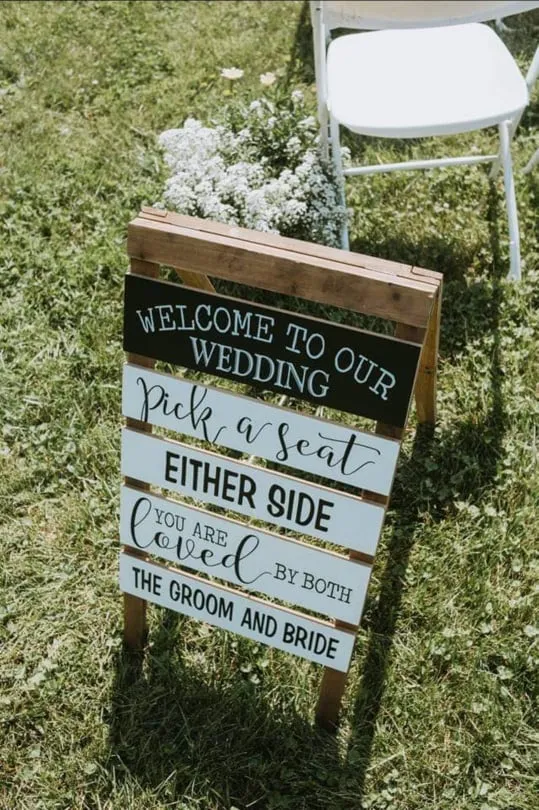 SIGN (FLOOR): "welcome to our wedding pick a seat, either side you are loved by both groom and bride