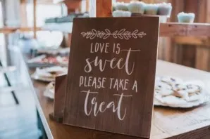 SIGN: rustic "love is sweet please take a treat"