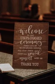 SIGN: rustic "welcome to our unplugged ceremony"