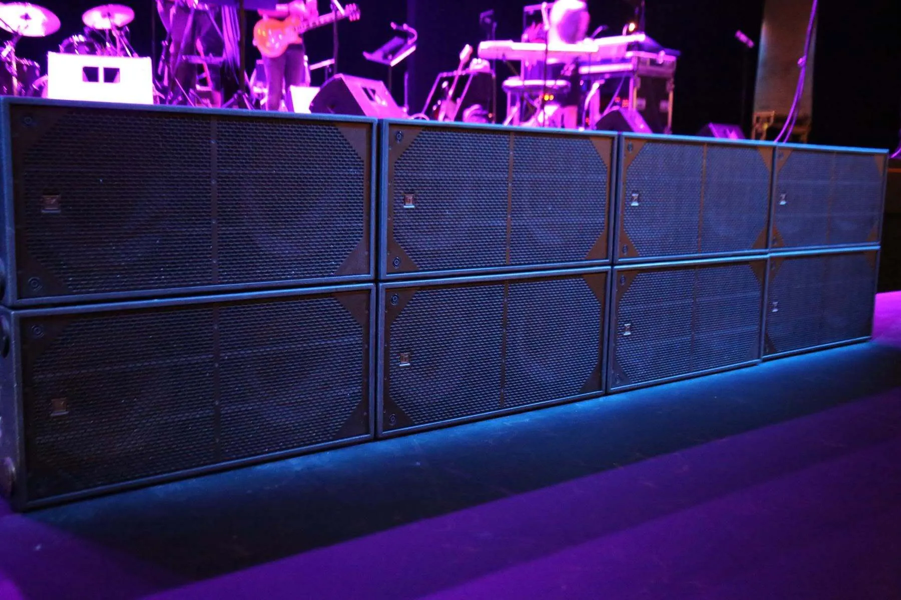 Professional EV subwoofer system providing powerful bass for a live music event.