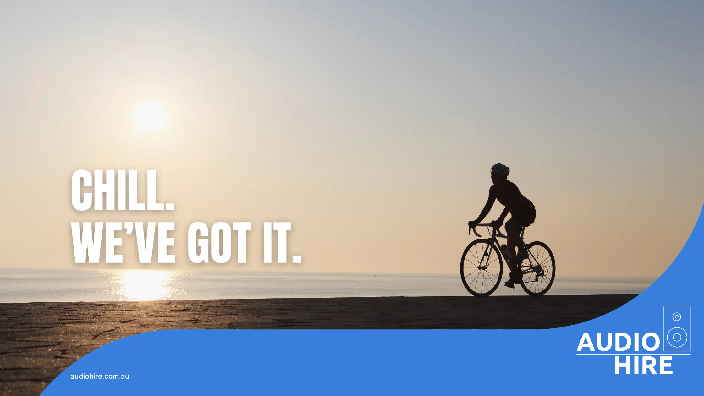 Cyclist on a beach at a Tour Down Under brand activation. Audio Hire.