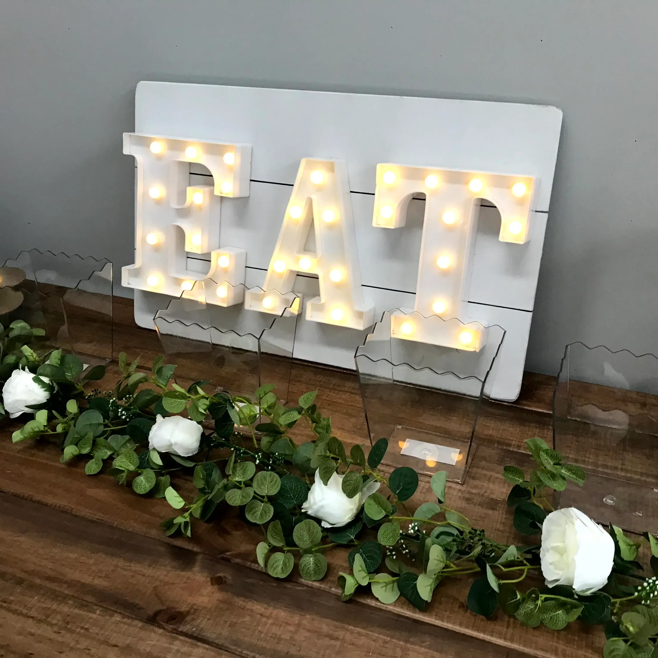 Illuminated "EAT" Sign