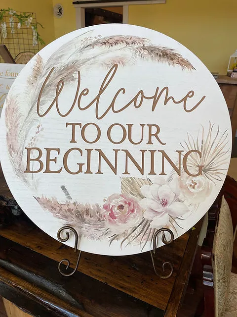 “Welcome to Our Beginning” White Round with Easel