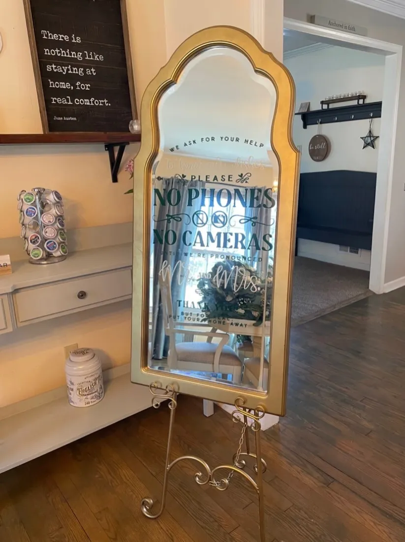 “No Phones No Cameras” Gold Sign