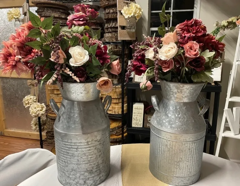 Dusty Rose Flowers in Large Metal Milk Cans