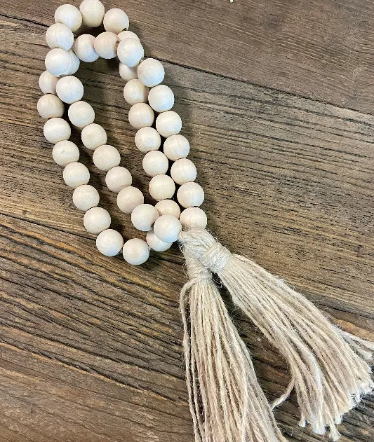 Display wooden white bead strands