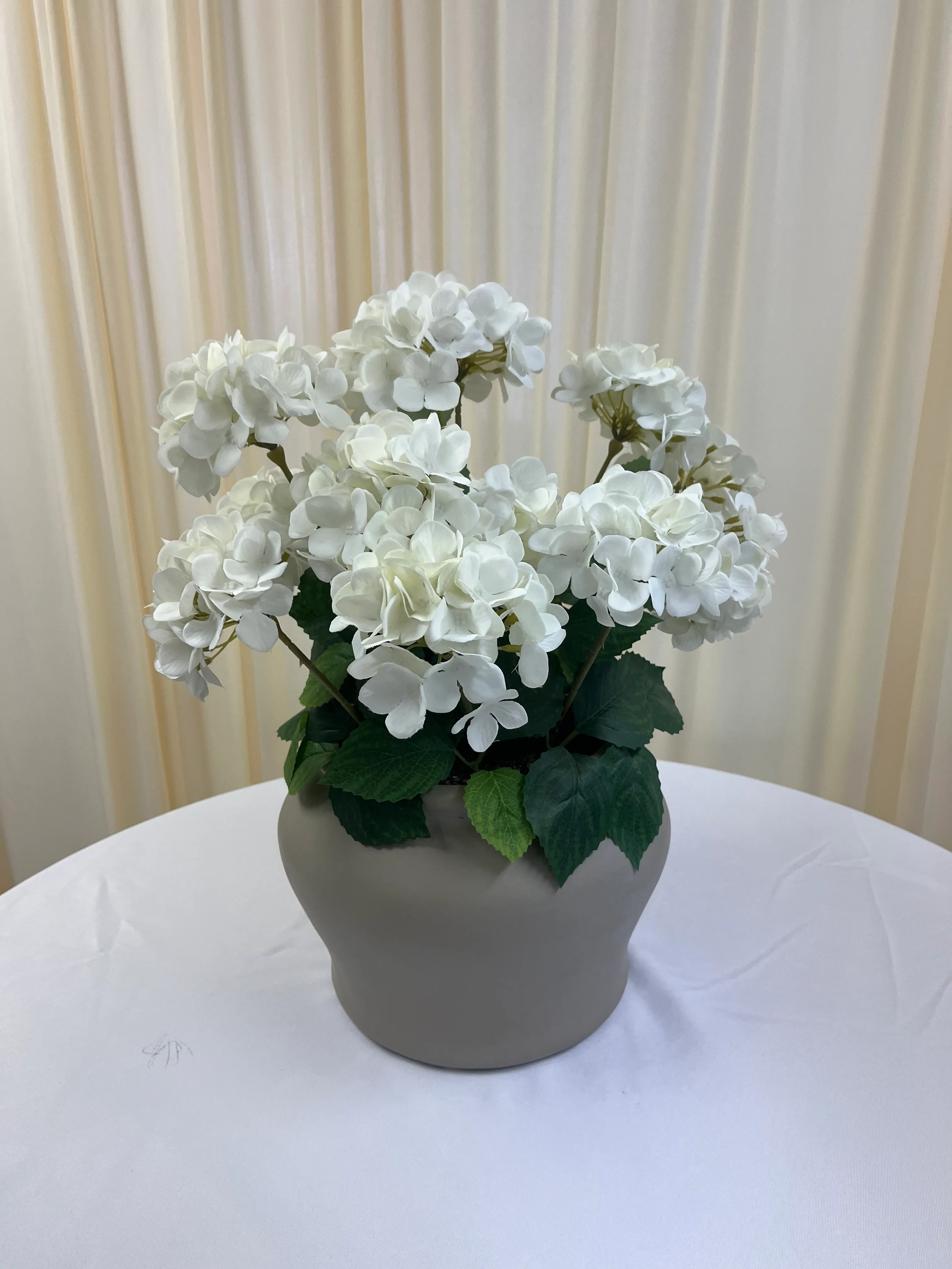 White Flowers in Gray Ceramic Vase