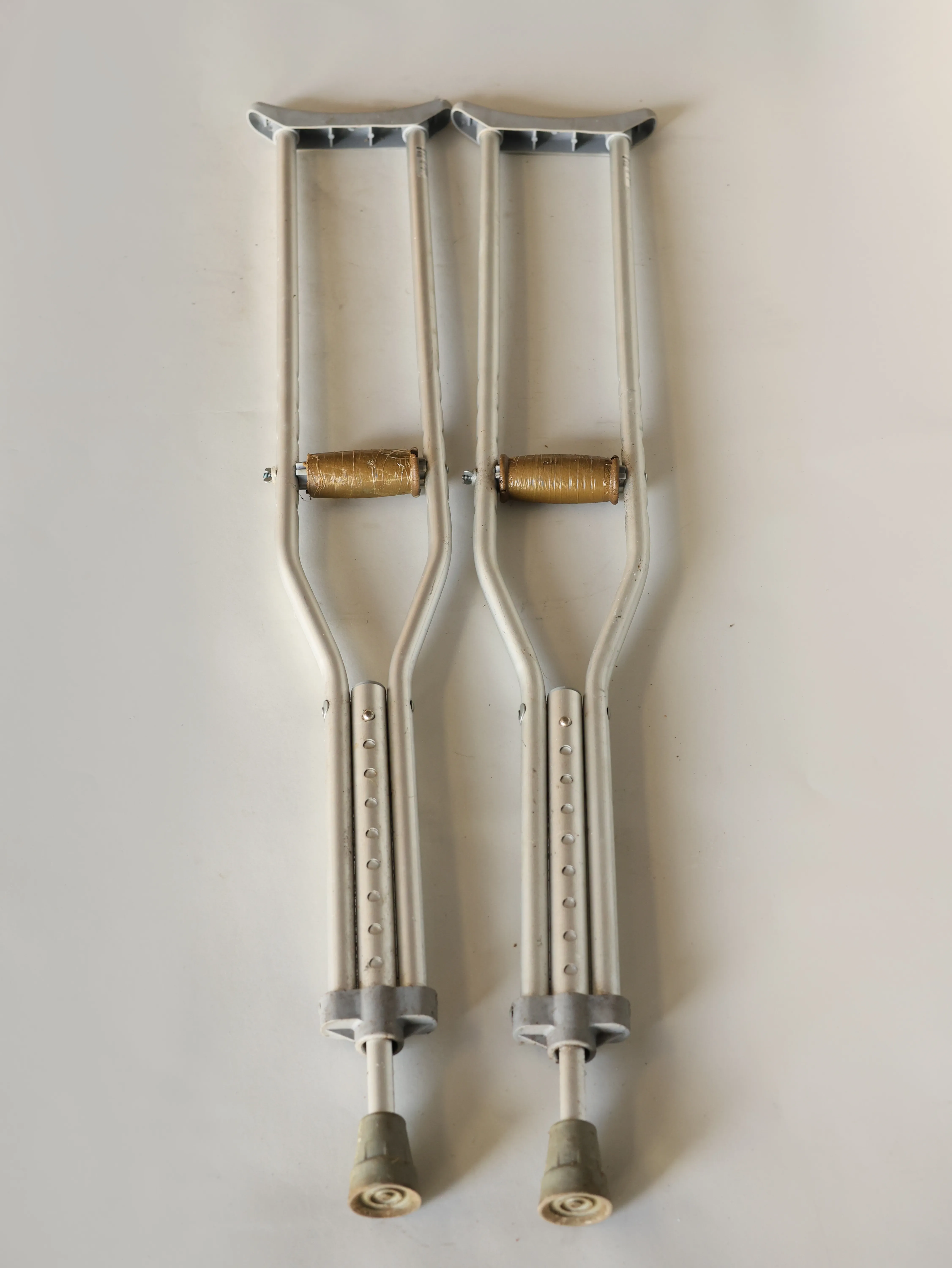 Worn Aluminum crutches adjustable