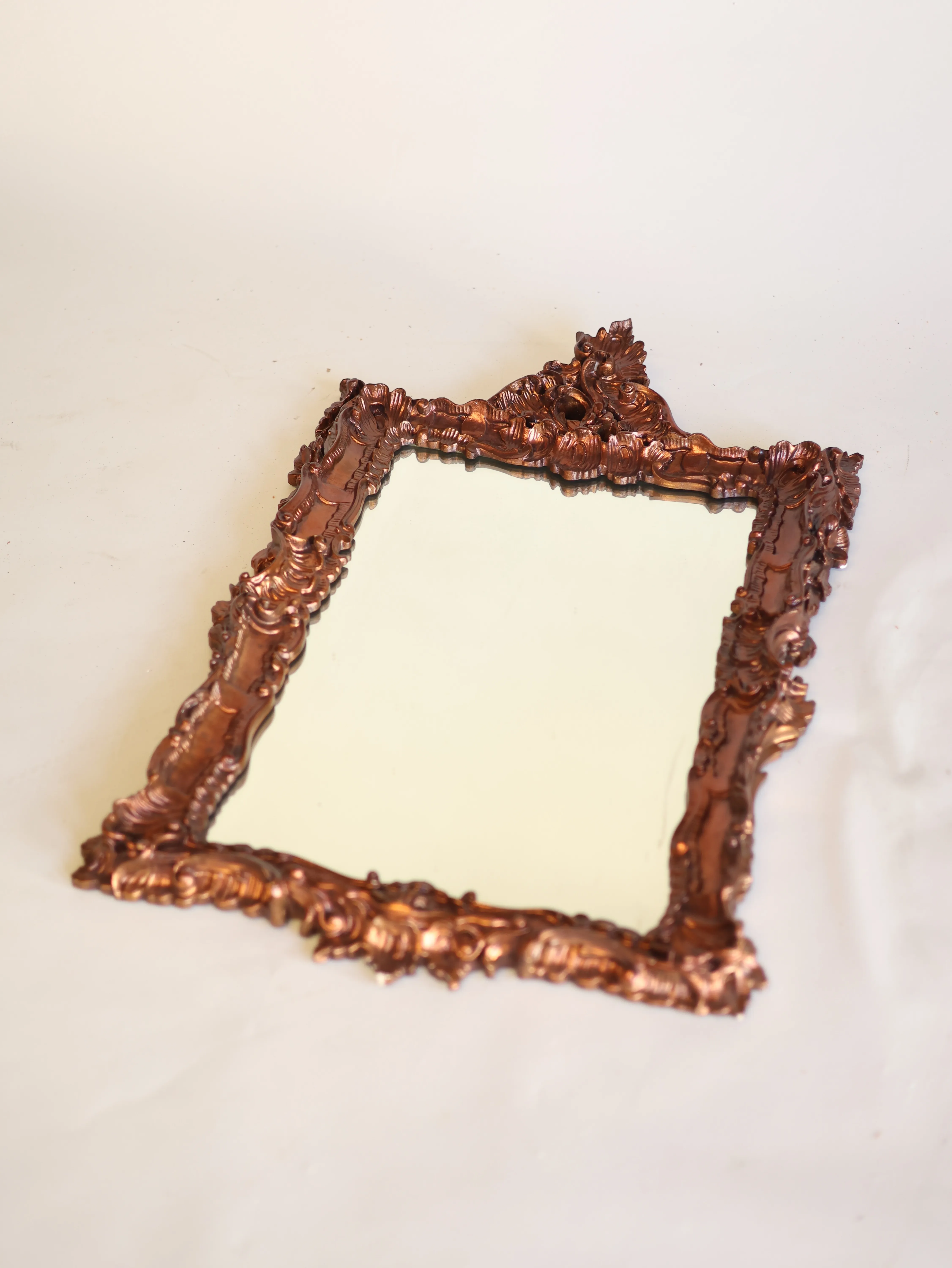 Carved copper mirror