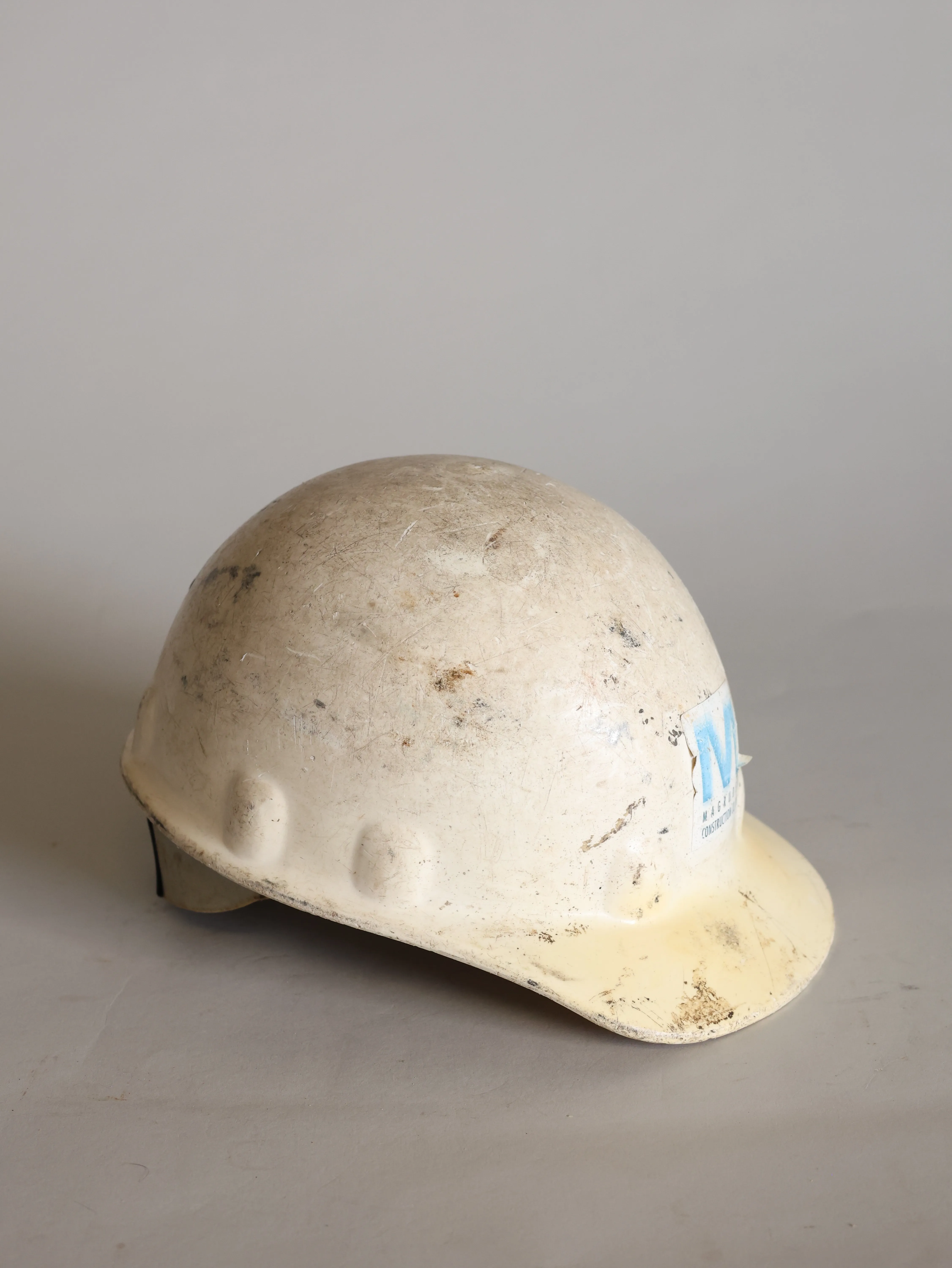 Used white construction helmet