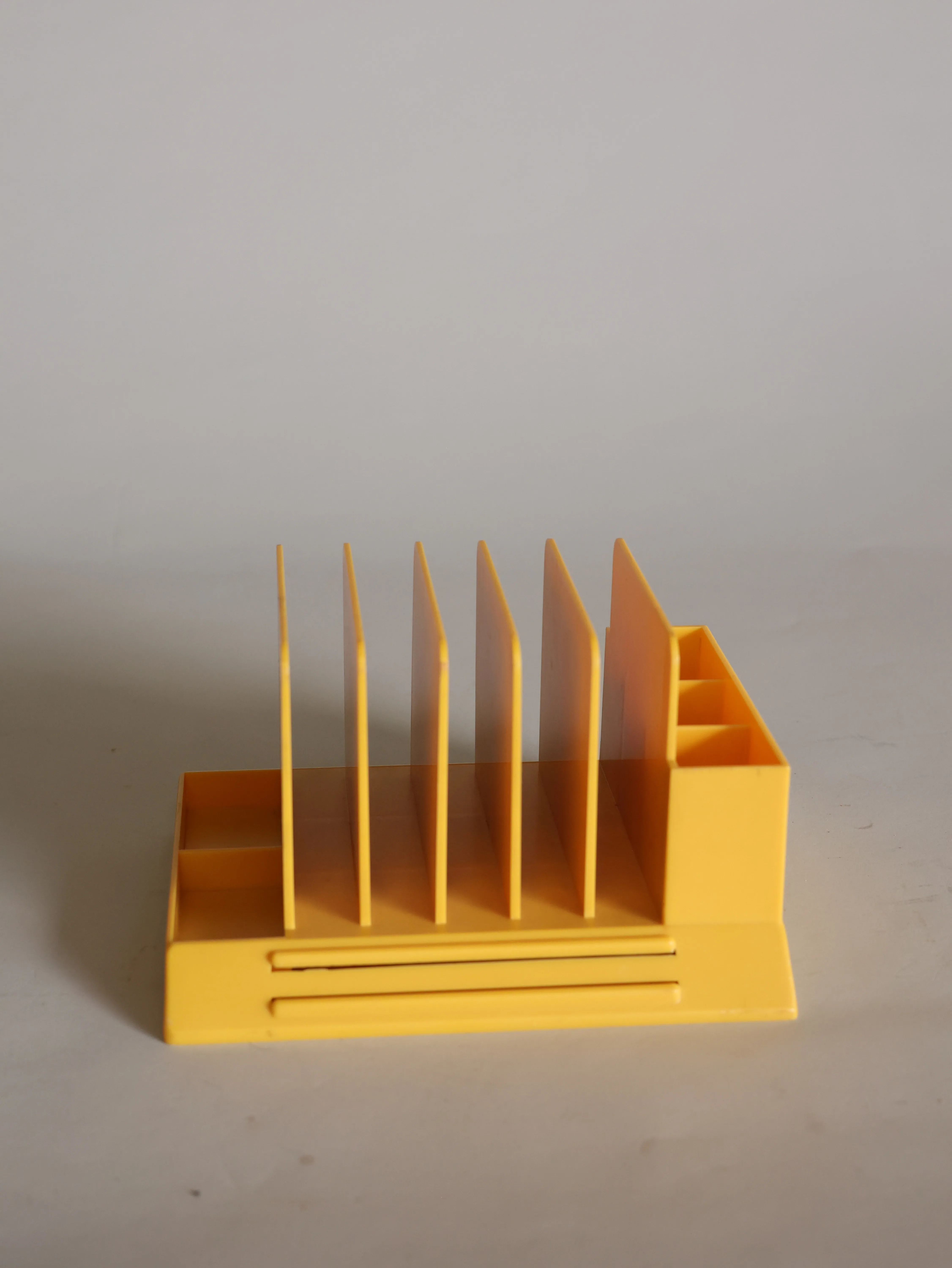 Paper organizer yellow plastic