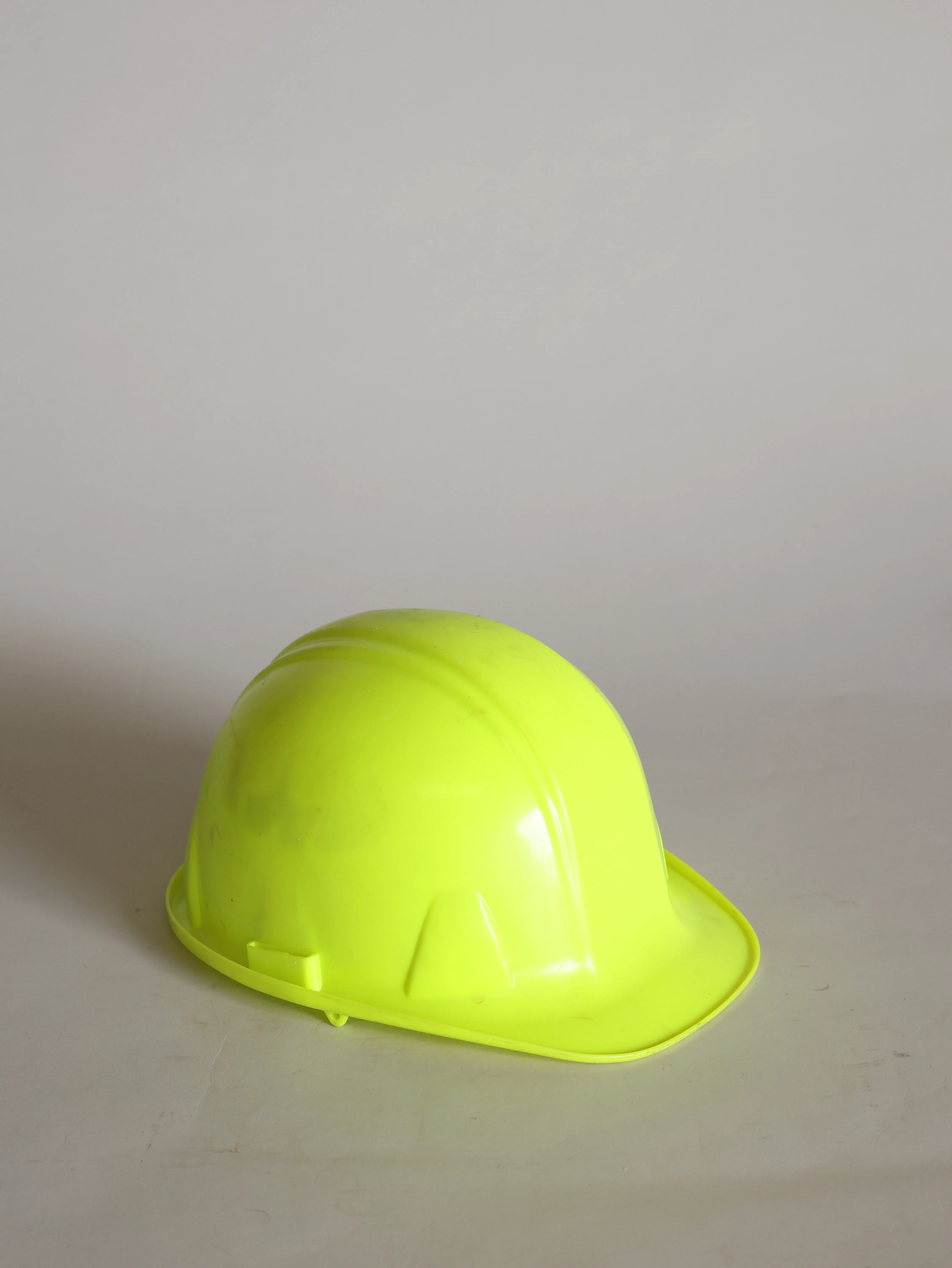 Used neon construction helmet