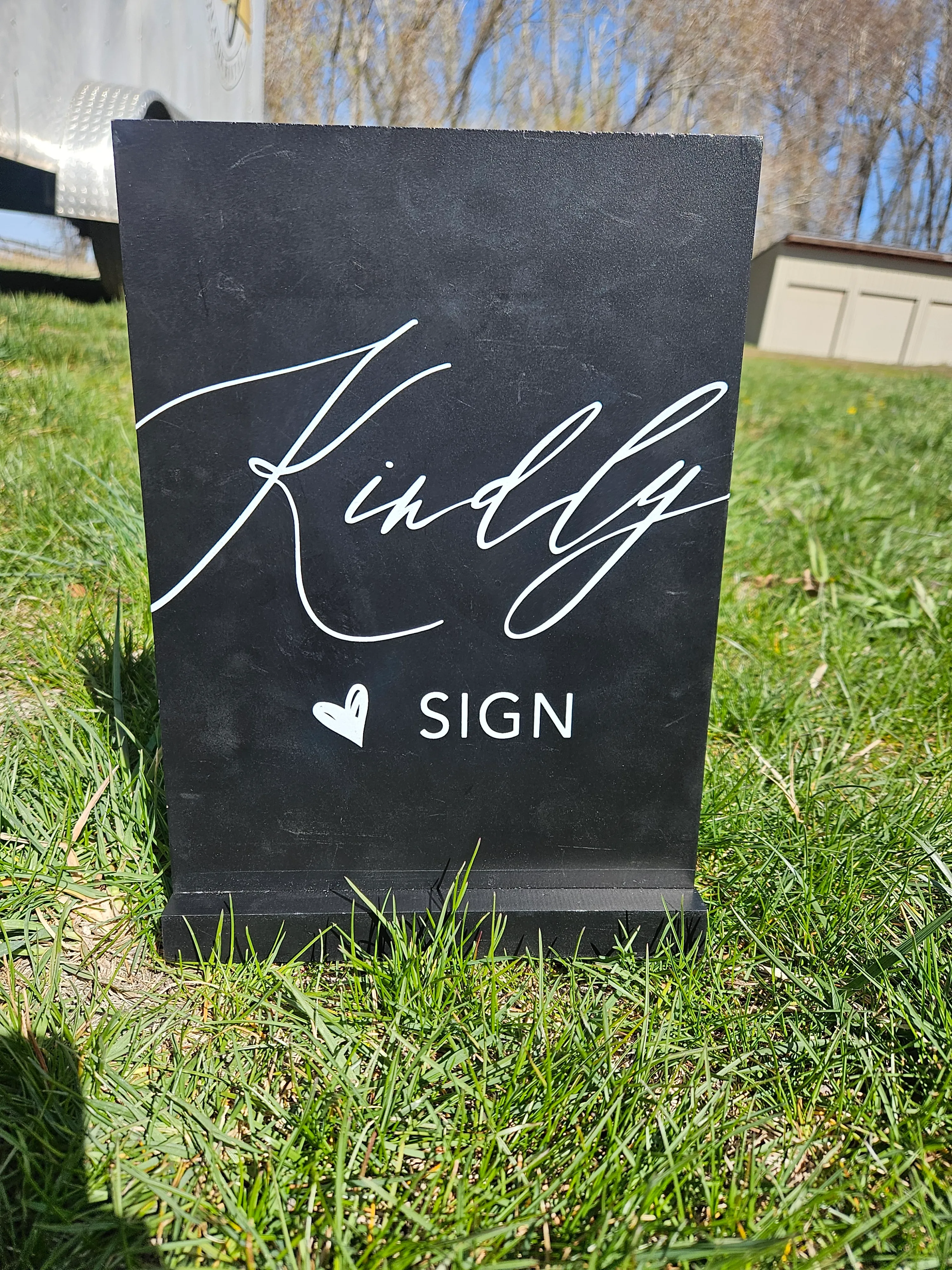 Kindly sign black wooden sign