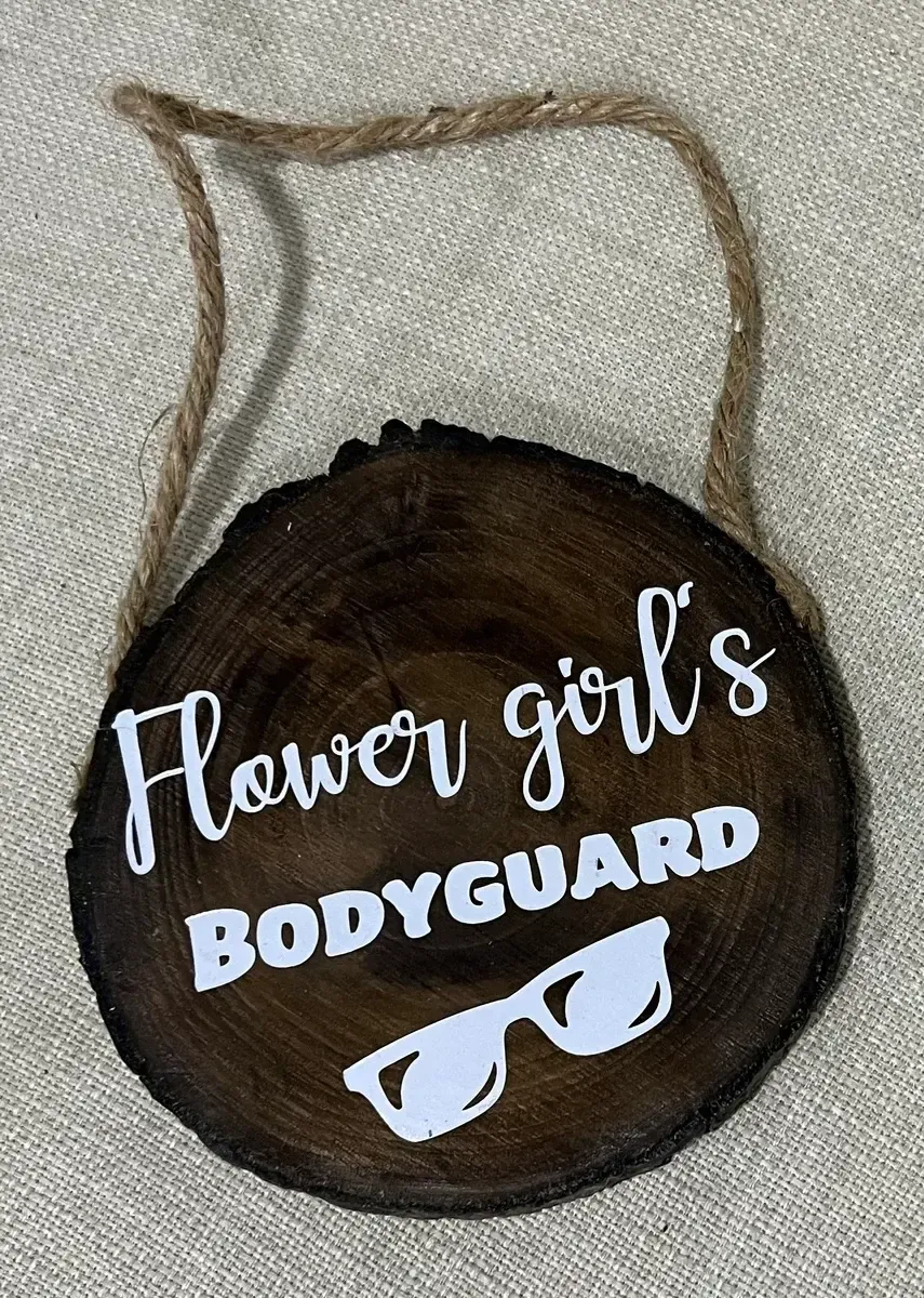 Flower girls body guard sign