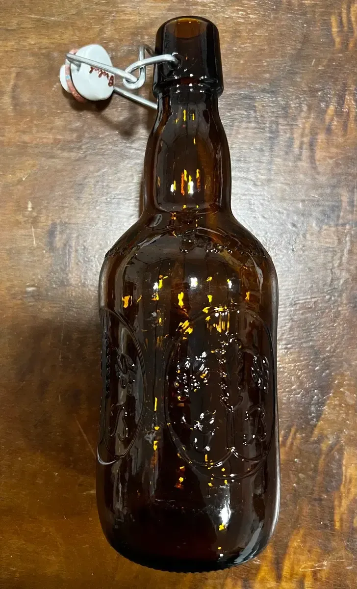 Amber brown bottle with white topper
