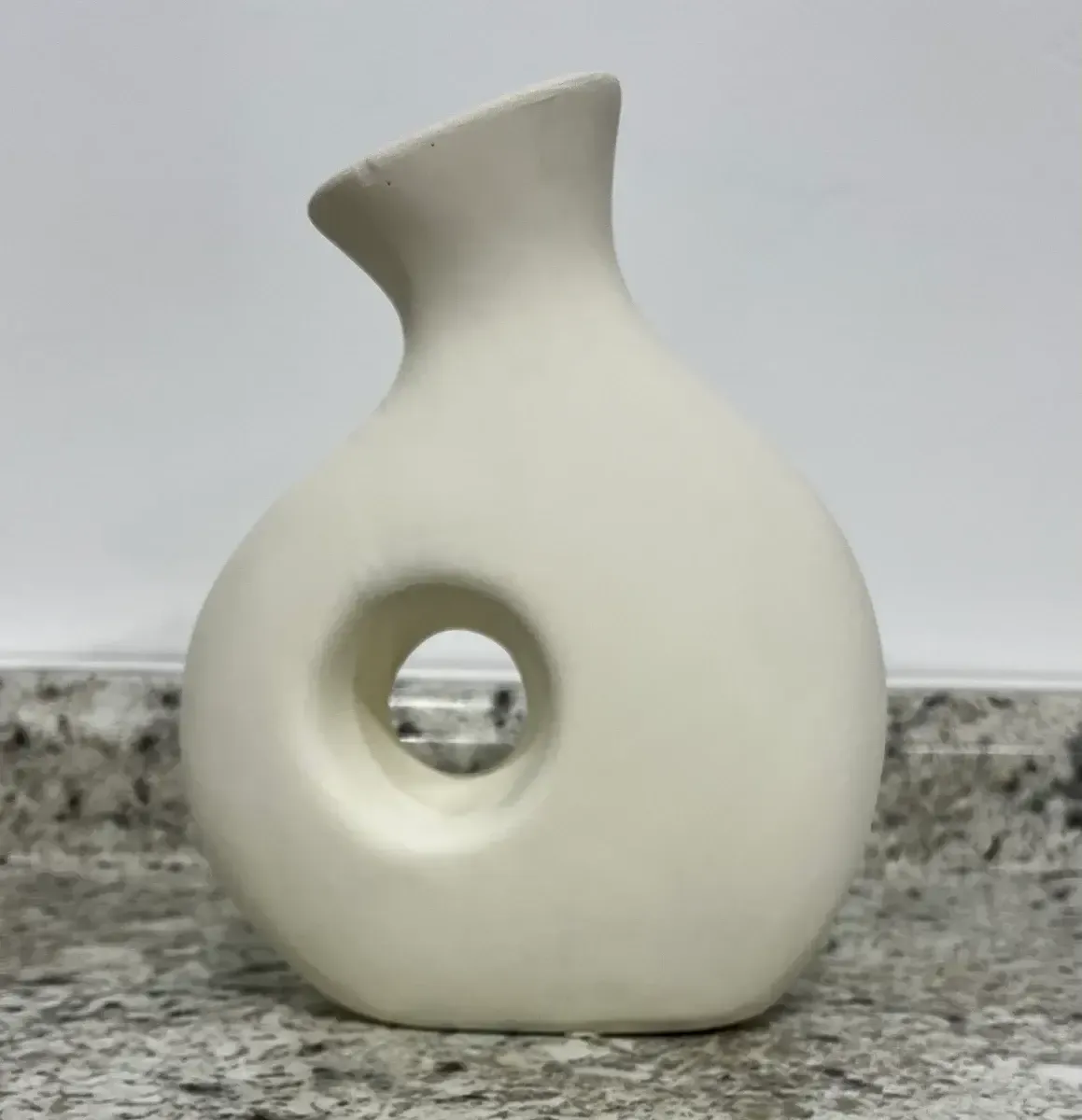 Creamy hole vase