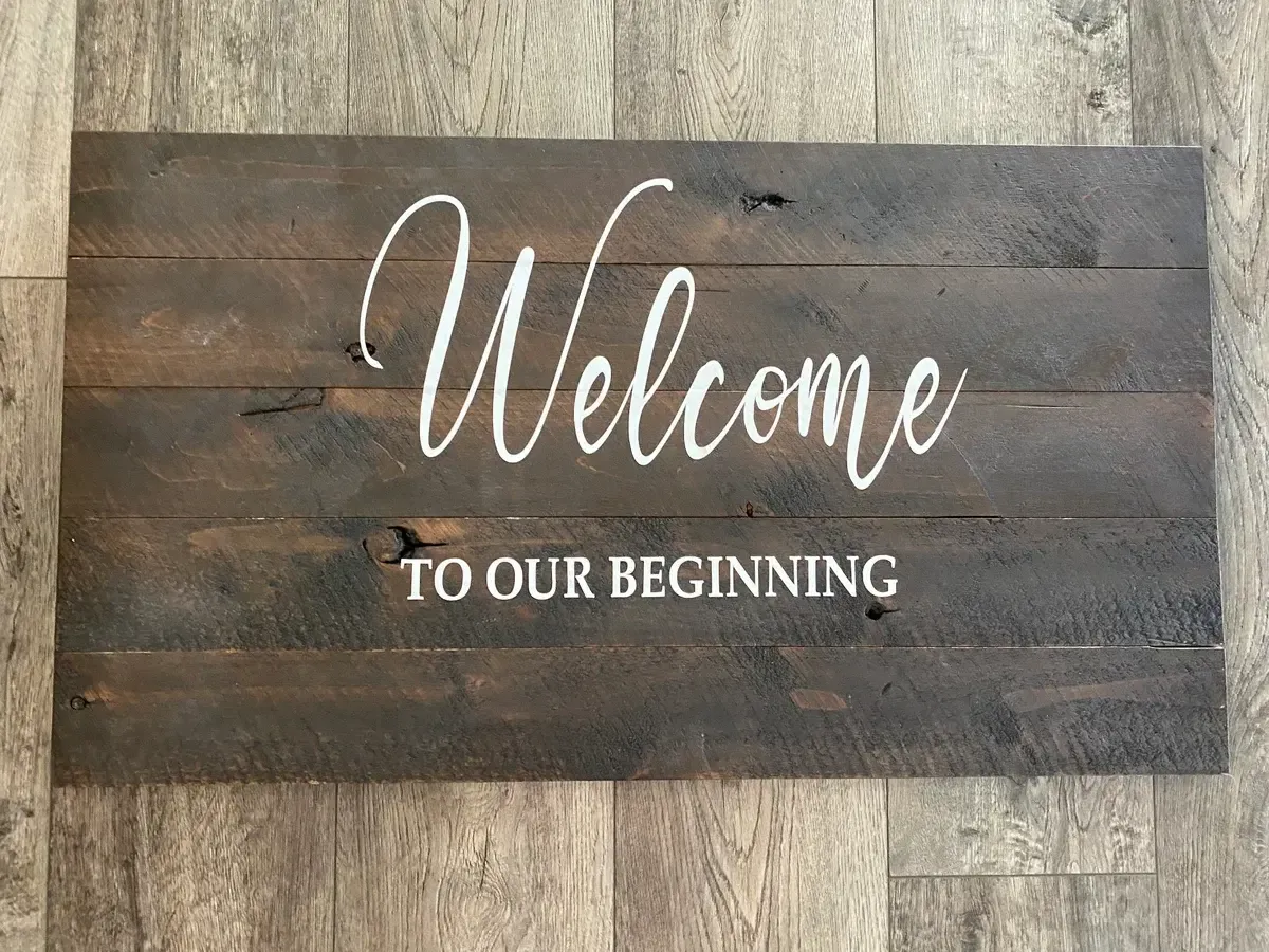 Welcome to our beginning dark wood sign