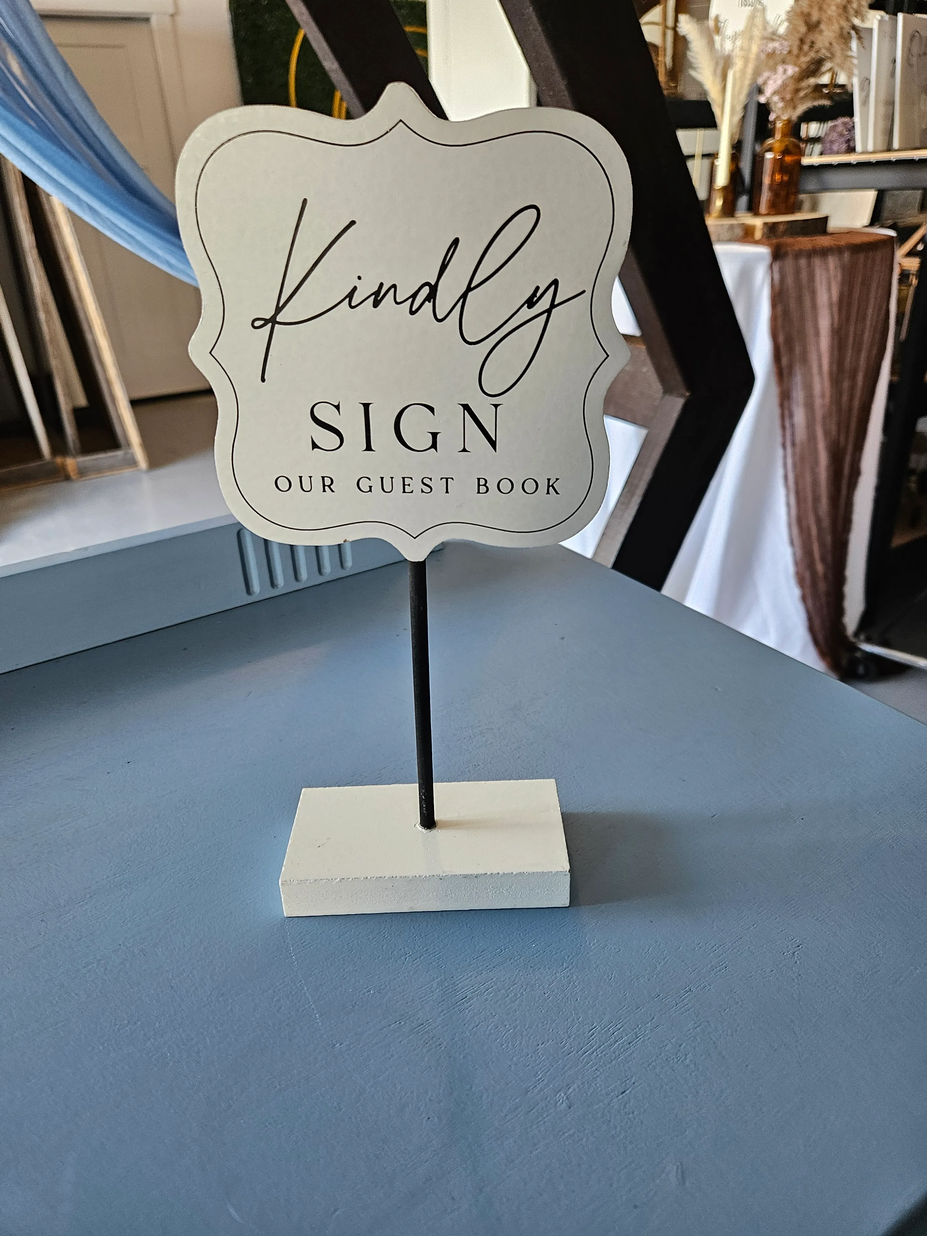 Kindly sign tall sign