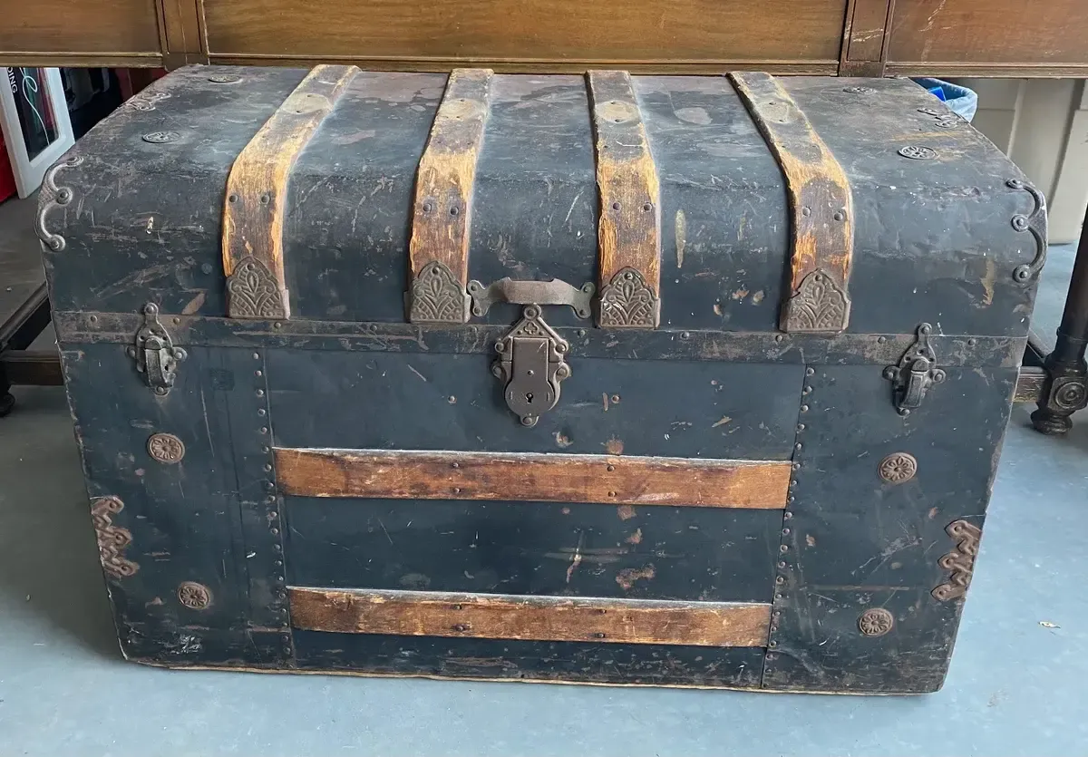 Antique black metal trunk