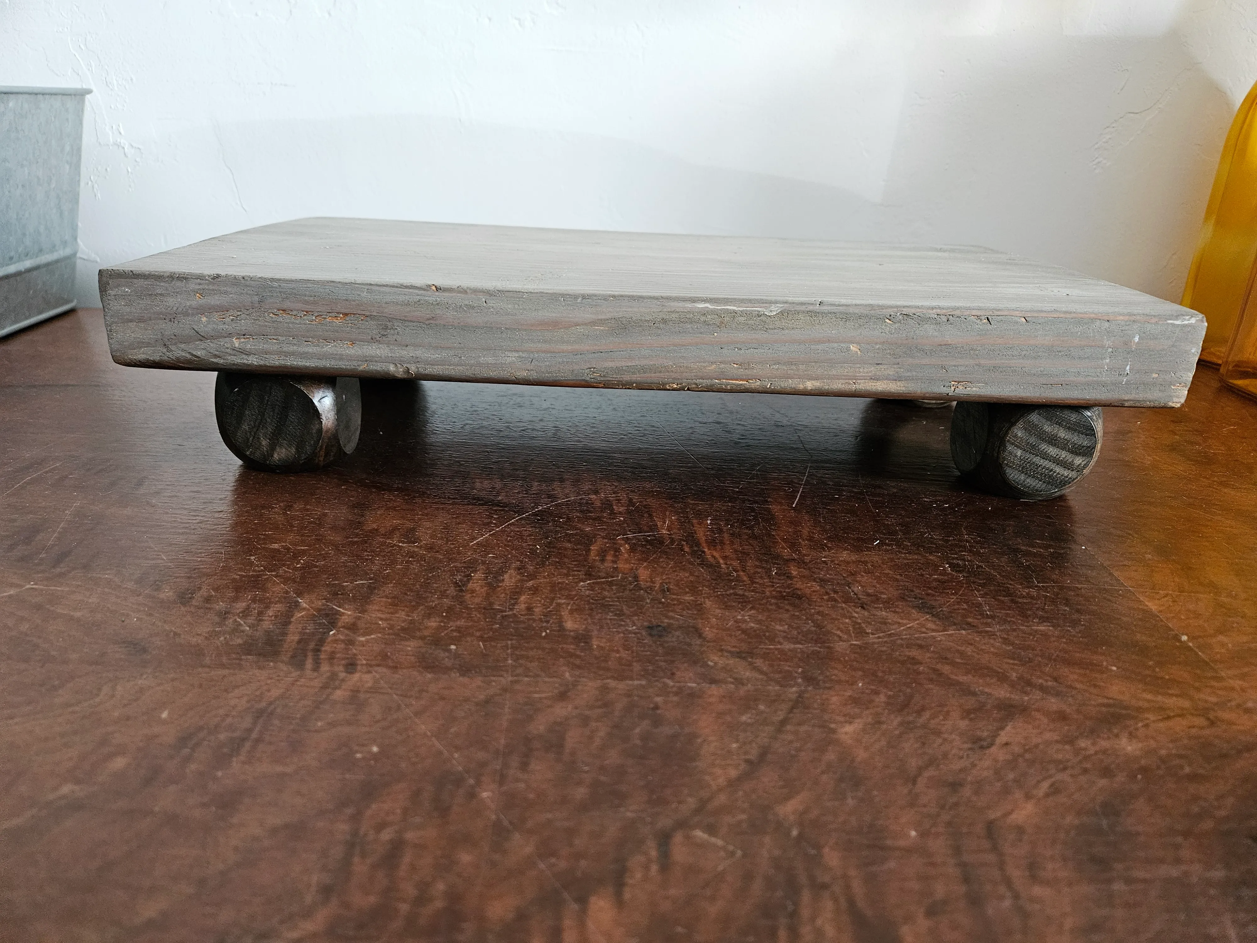 Wood riser with brown legs