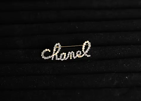 Chanel Cursive Pearl Brooch
