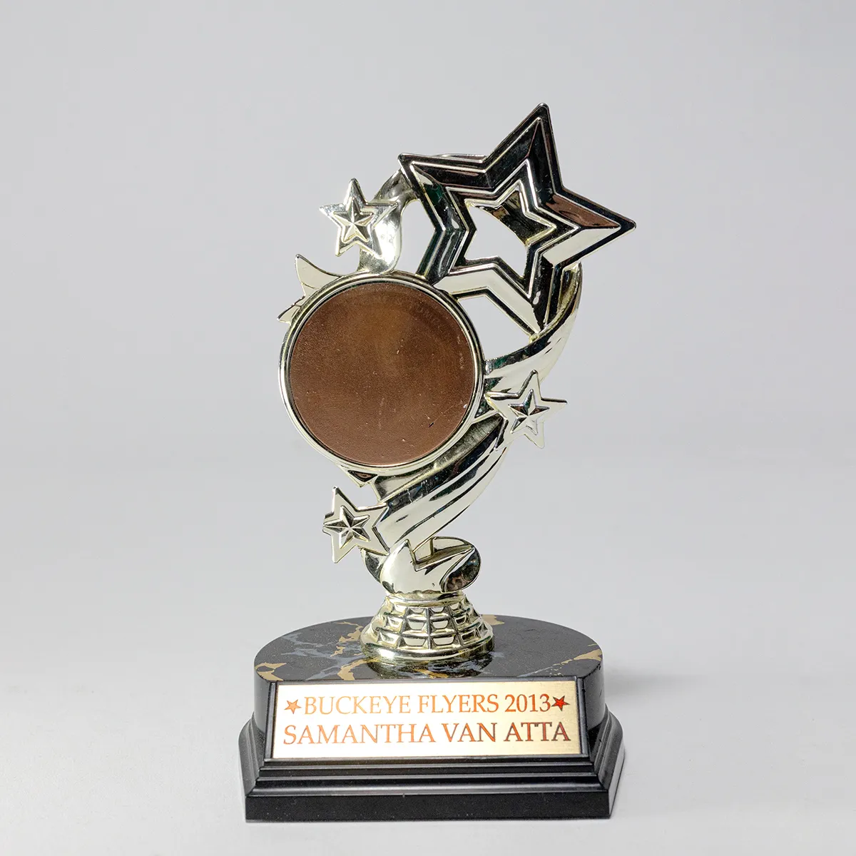 Gold Plastic Shooting Stars Trophy with Half Circle Black Plastic Base