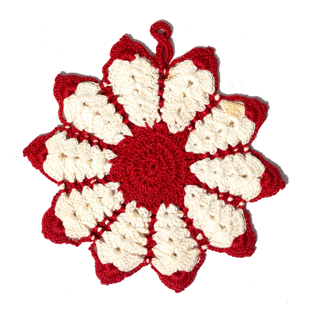 red and white knitted flower shaped hot oven mit