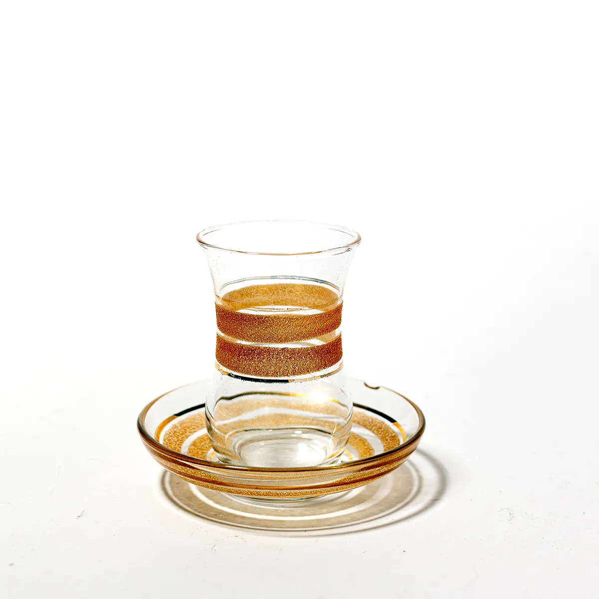 MCM Mid Century-Modern Hourglass shaped Shot Glasses with Matte Gold Around the Middle and Shiny Gold Flanking it. Each shot Glass comes with a 4" clear and gold glass saucer 