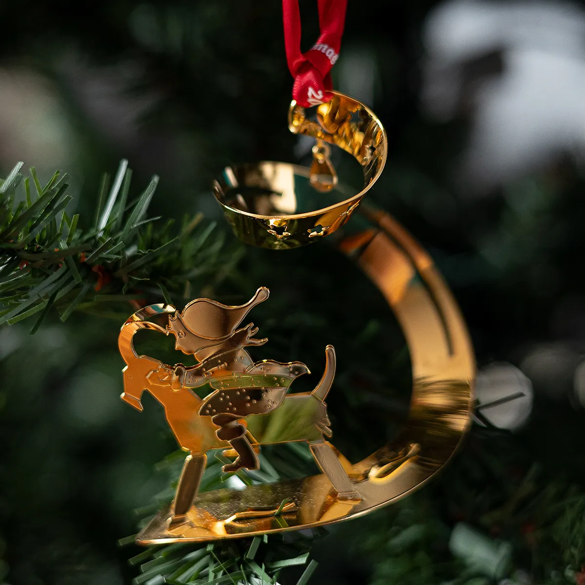 Georg Jensen Christmas Mobile 2002 - Christmas Bustle - Gold Plated a child riding a Goat riding a shwoop of gold snow