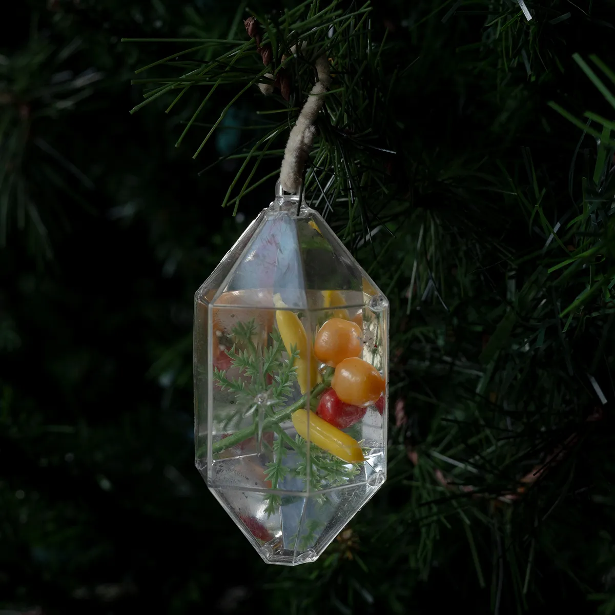 Christmas Tree Ornament: Clear and Silver and Gold Diorama with tiny plastic fruit inside white pip cleaner hook