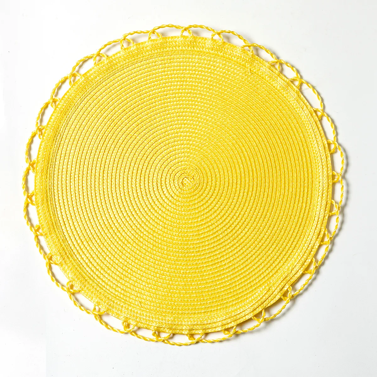 bright baby yellow round woven wicker placemat with braided scalloped edge