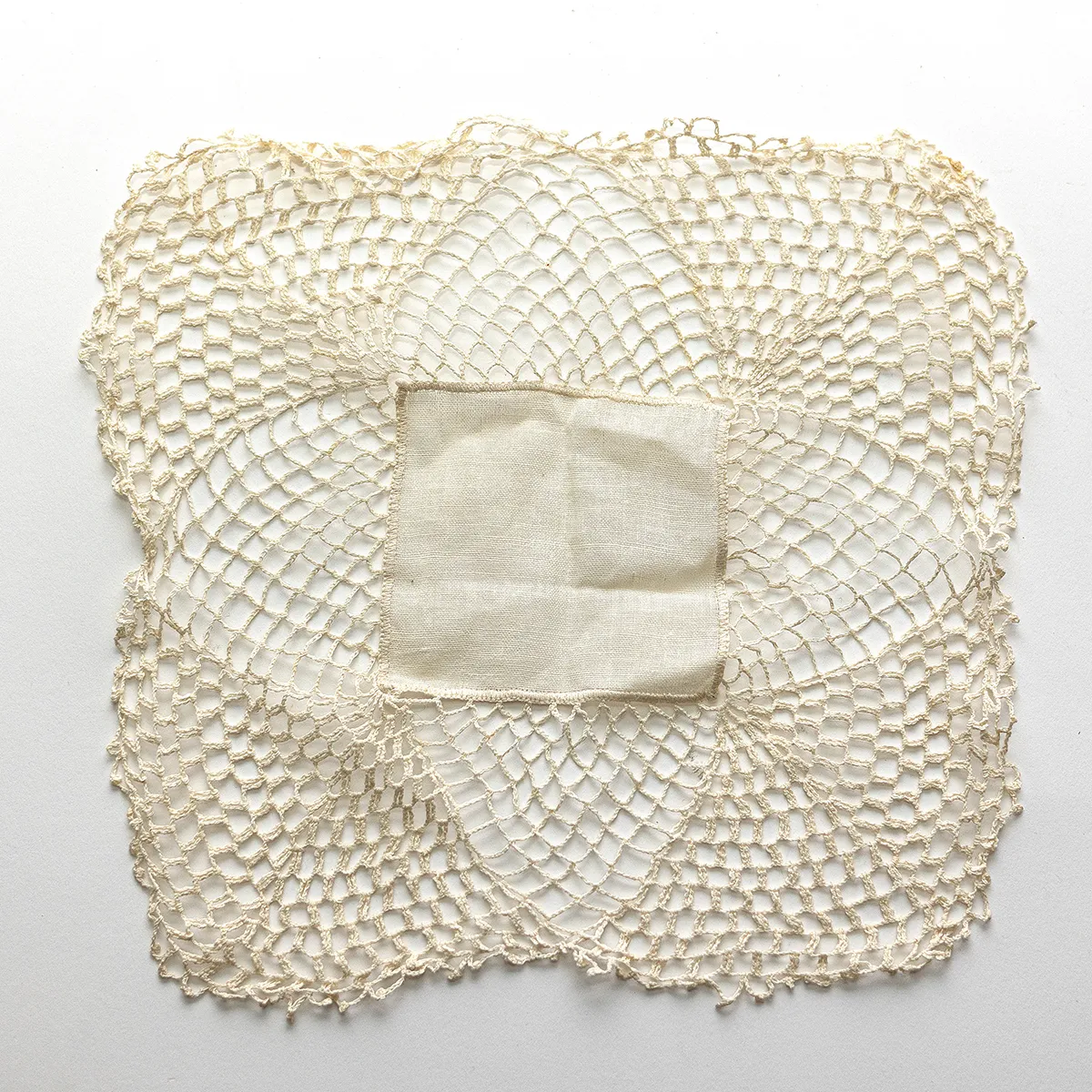 Vintage Handmade Crocheted Lace Cream White colored Doily Square with a patch of white fabric in the center
